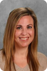 a woman with light brown hair smiles at the camera